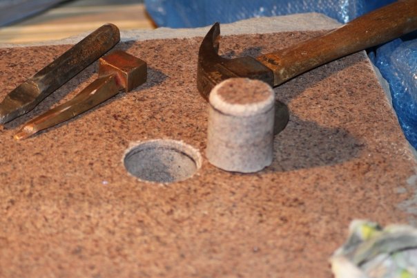 Figure 21. Hole and core with chisel wedge and hammer