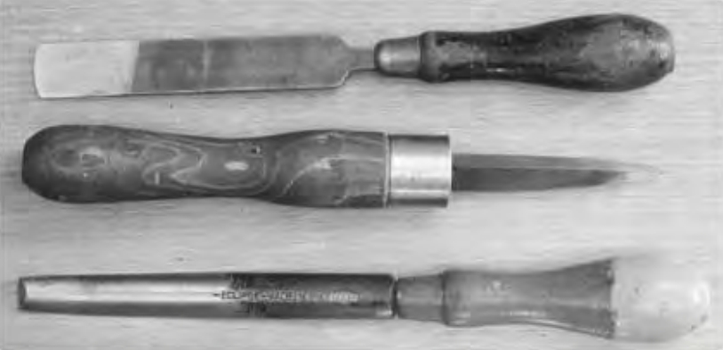 Figure 6.5. Three different engineering hand scrapers. Photograph taken by Glenn McKechnie on the 24th March 2005